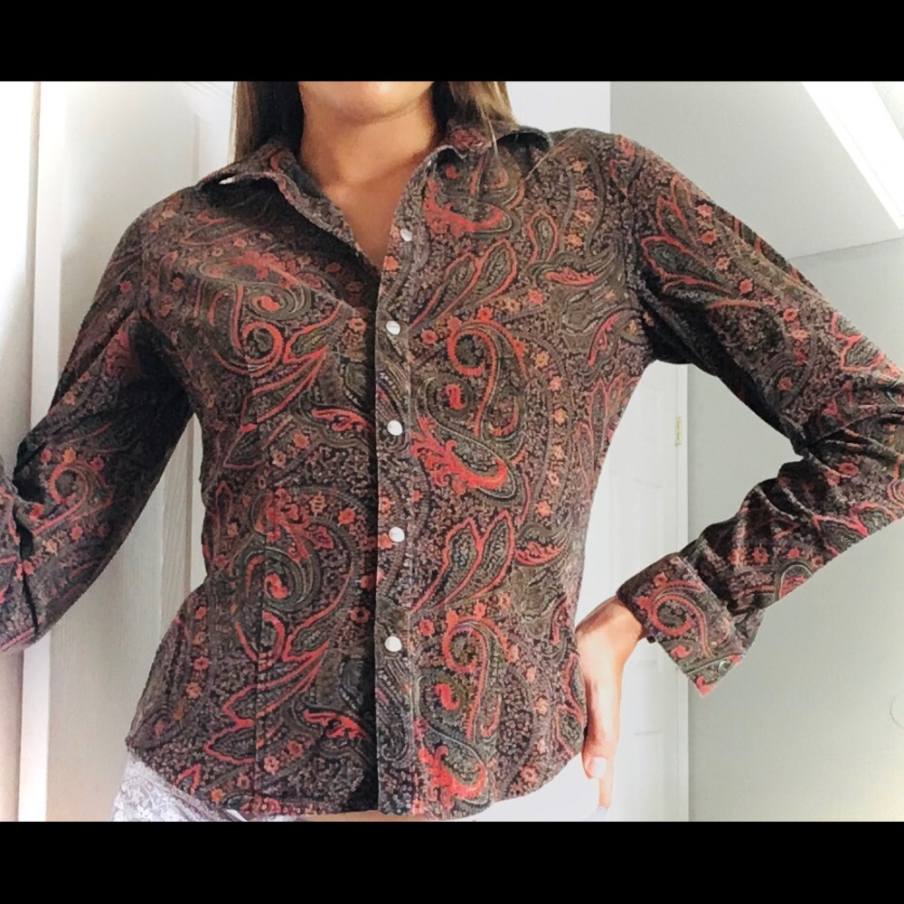 Long sleeved button down shirt. Size S.